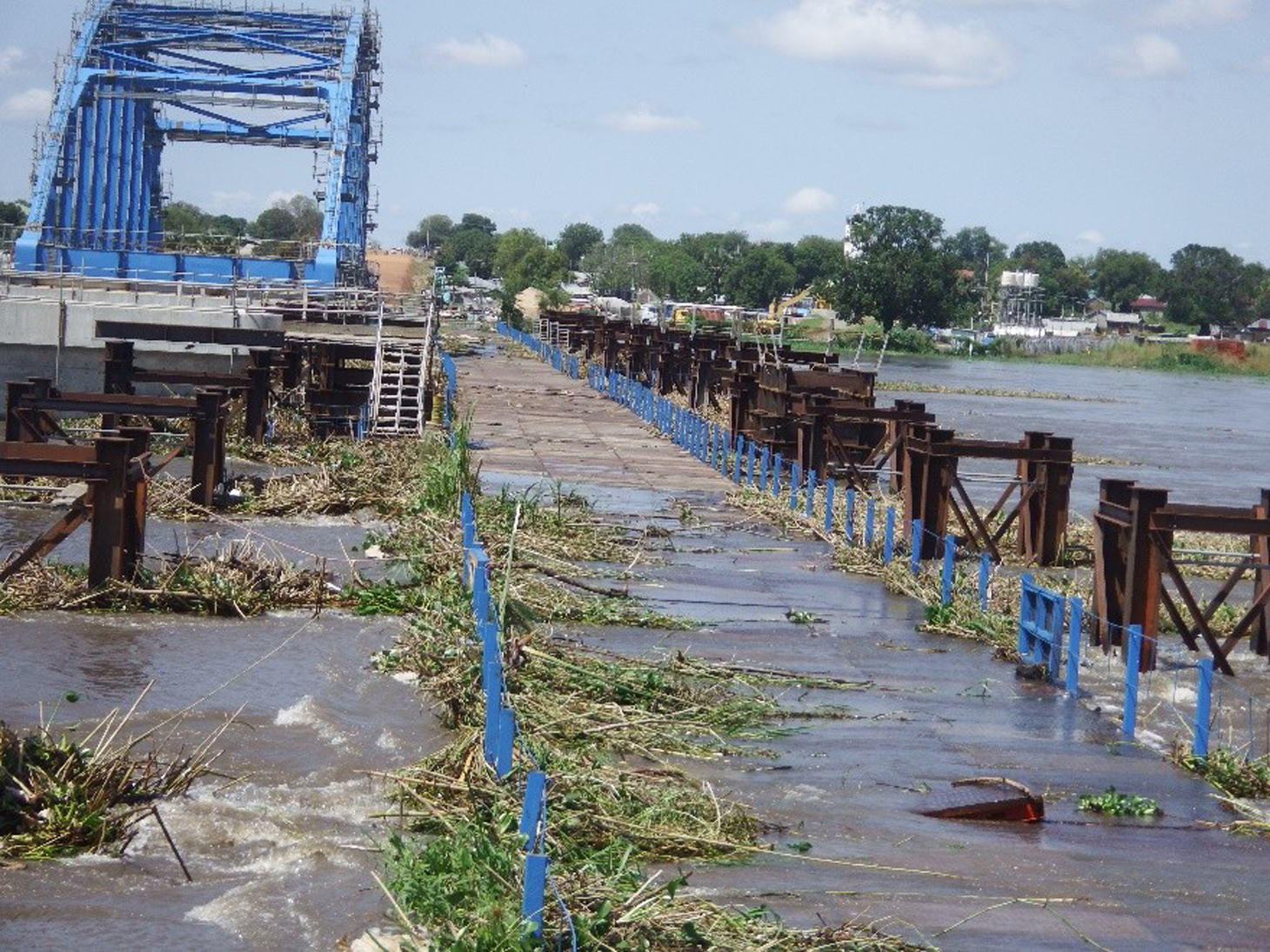 Photo 9: Water Level Overflowed Temporary Bridge